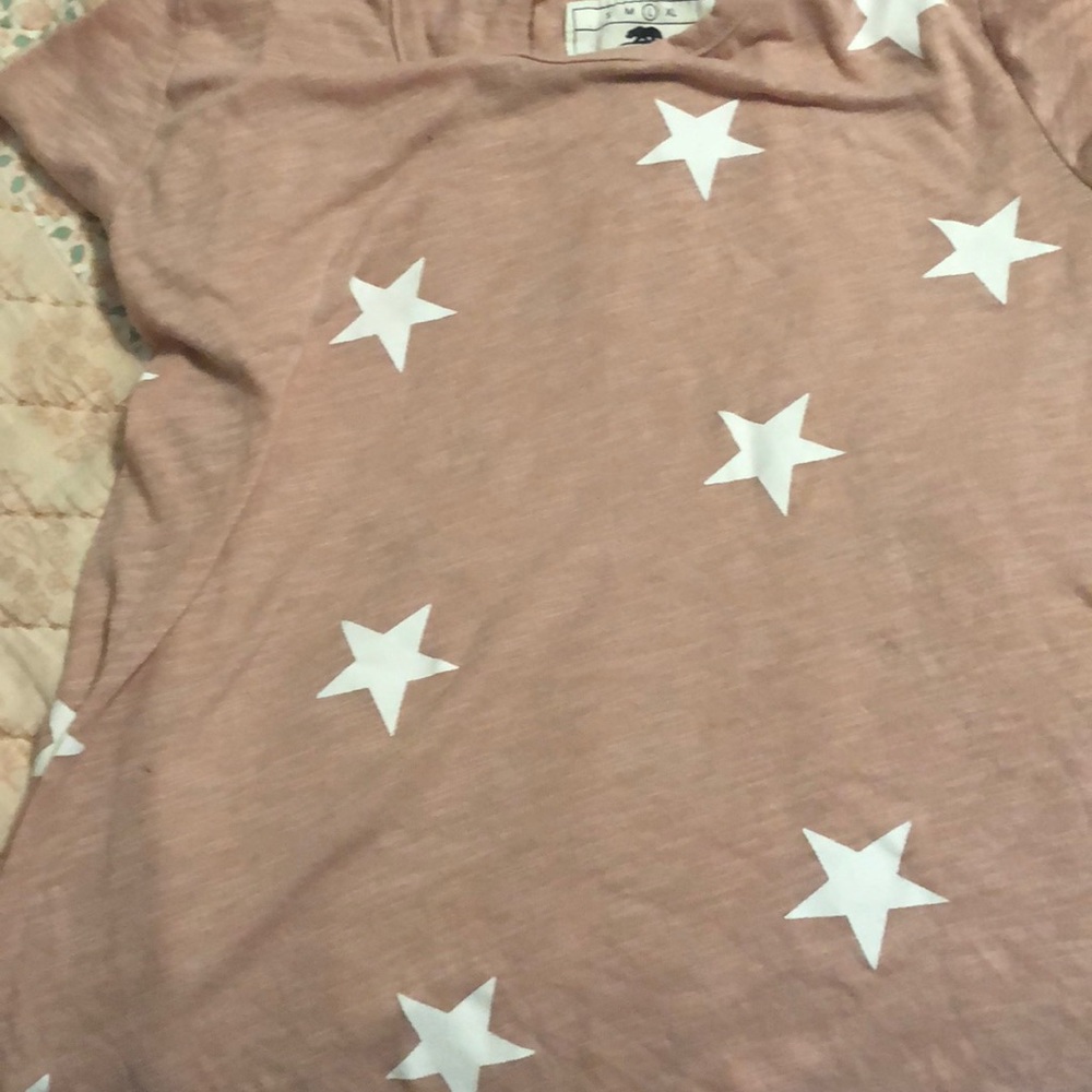 A  pink and white short sleeve shirt